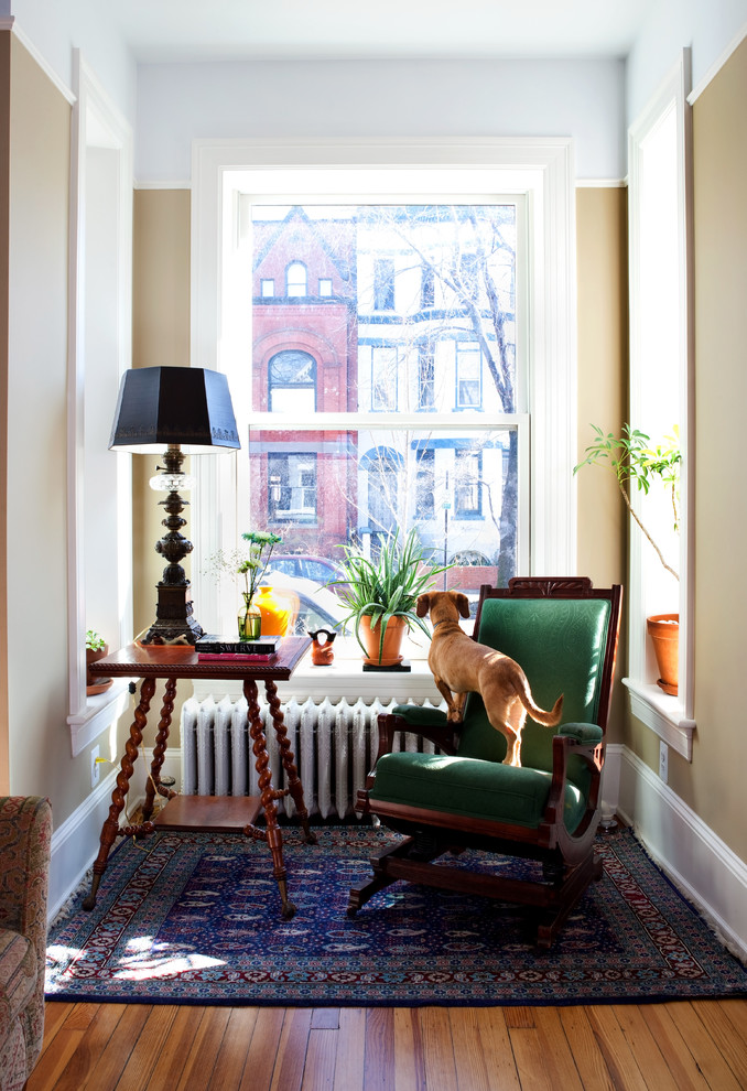 Hallway - small transitional medium tone wood floor hallway idea in DC Metro with beige walls