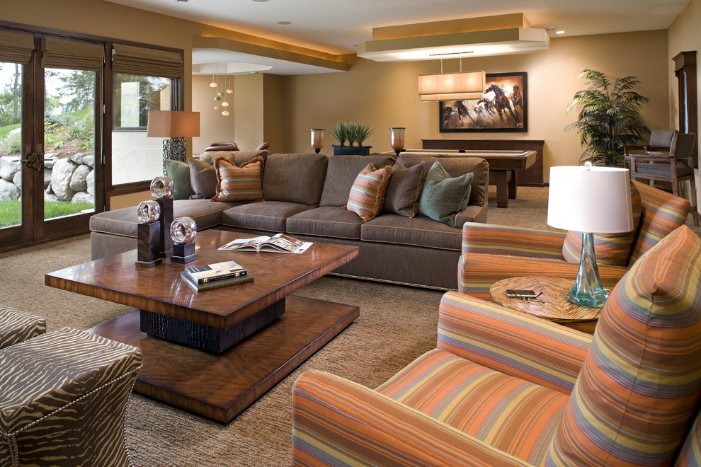 Contemporary open concept family room in Minneapolis with a game room, beige walls and carpet.