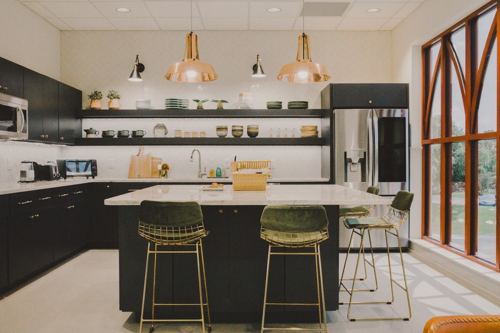 This is an example of a large scandinavian l-shaped eat-in kitchen in Tampa with a drop-in sink, flat-panel cabinets, grey cabinets, marble benchtops, white splashback, subway tile splashback, stainless steel appliances, ceramic floors, with island, grey floor and white benchtop.