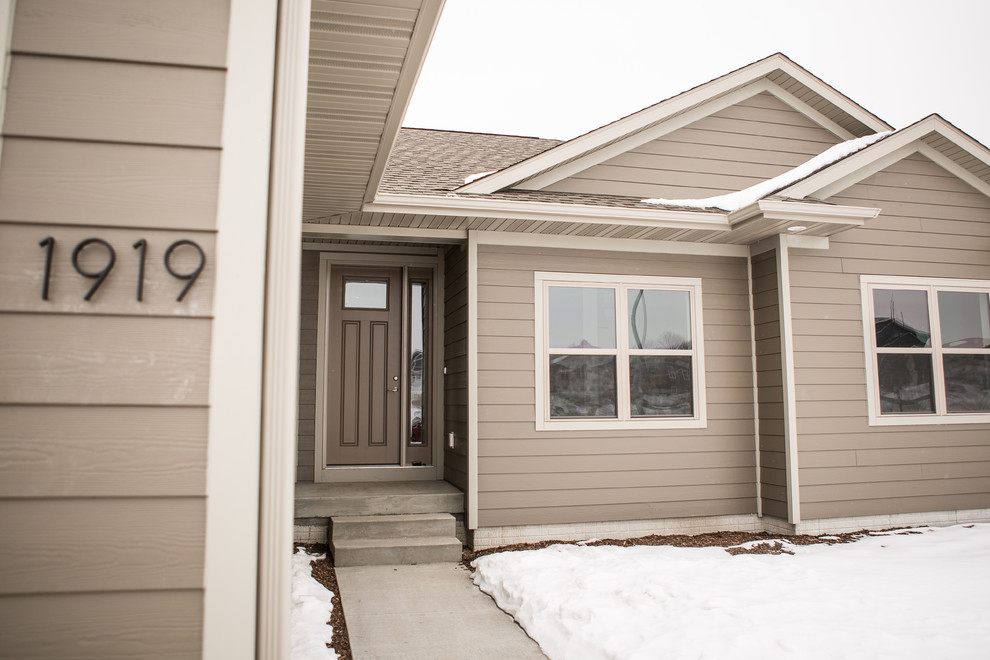 Inspiration for a transitional exterior home remodel in Cedar Rapids