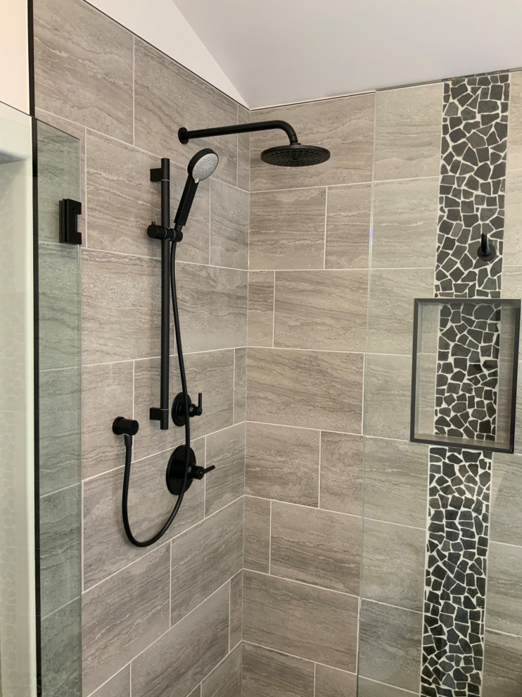 Inspiration for a large contemporary master bathroom in Calgary with shaker cabinets, white cabinets, a drop-in tub, a corner shower, a one-piece toilet, gray tile, porcelain tile, white walls, porcelain floors, an undermount sink, engineered quartz benchtops, grey floor, a hinged shower door and white benchtops.