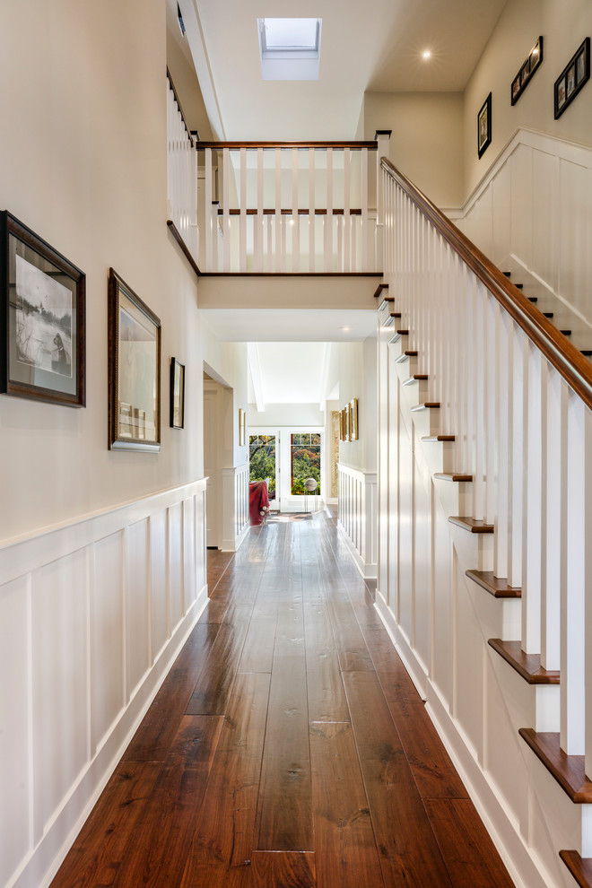Design ideas for a mid-sized traditional hallway in Orange County with medium hardwood floors, brown floor and grey walls.