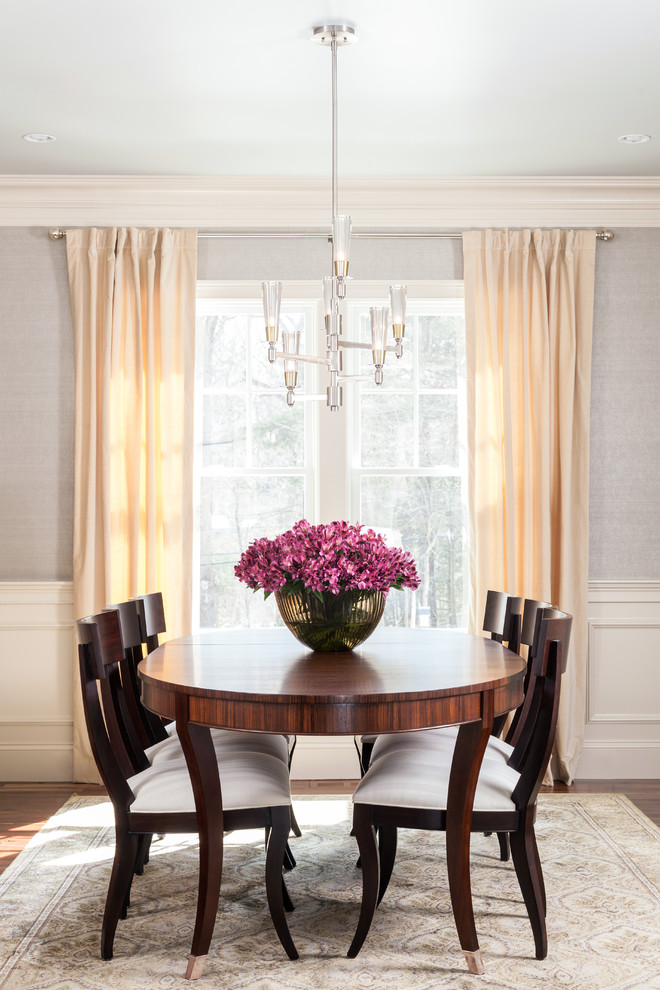 Photo of a transitional dining room in Boston with beige walls.