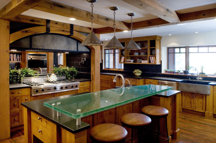 Inspiration for a large rustic light wood floor eat-in kitchen remodel in DC Metro with a farmhouse sink, light wood cabinets, black backsplash and an island