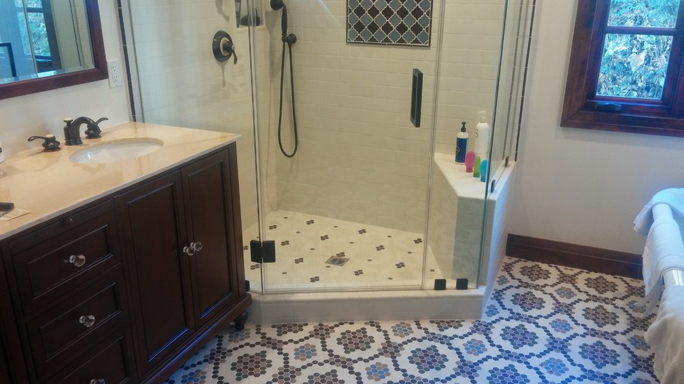 Design ideas for a mid-sized traditional bathroom in Los Angeles with recessed-panel cabinets, dark wood cabinets, a corner shower, white tile, subway tile, mosaic tile floors, a hinged shower door, an undermount sink and a claw-foot tub.