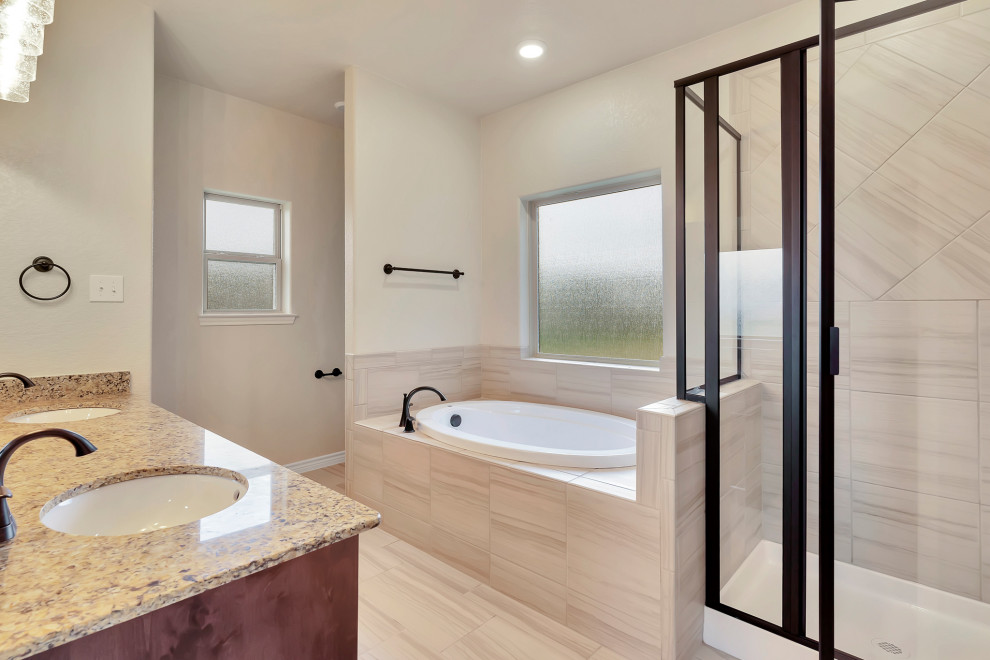 Design ideas for a mid-sized modern master bathroom in Austin with dark wood cabinets, a drop-in tub, an alcove shower, a one-piece toilet, beige tile, ceramic tile, white walls, ceramic floors, an undermount sink, granite benchtops, beige floor, a hinged shower door, beige benchtops, an enclosed toilet, a double vanity and a built-in vanity.