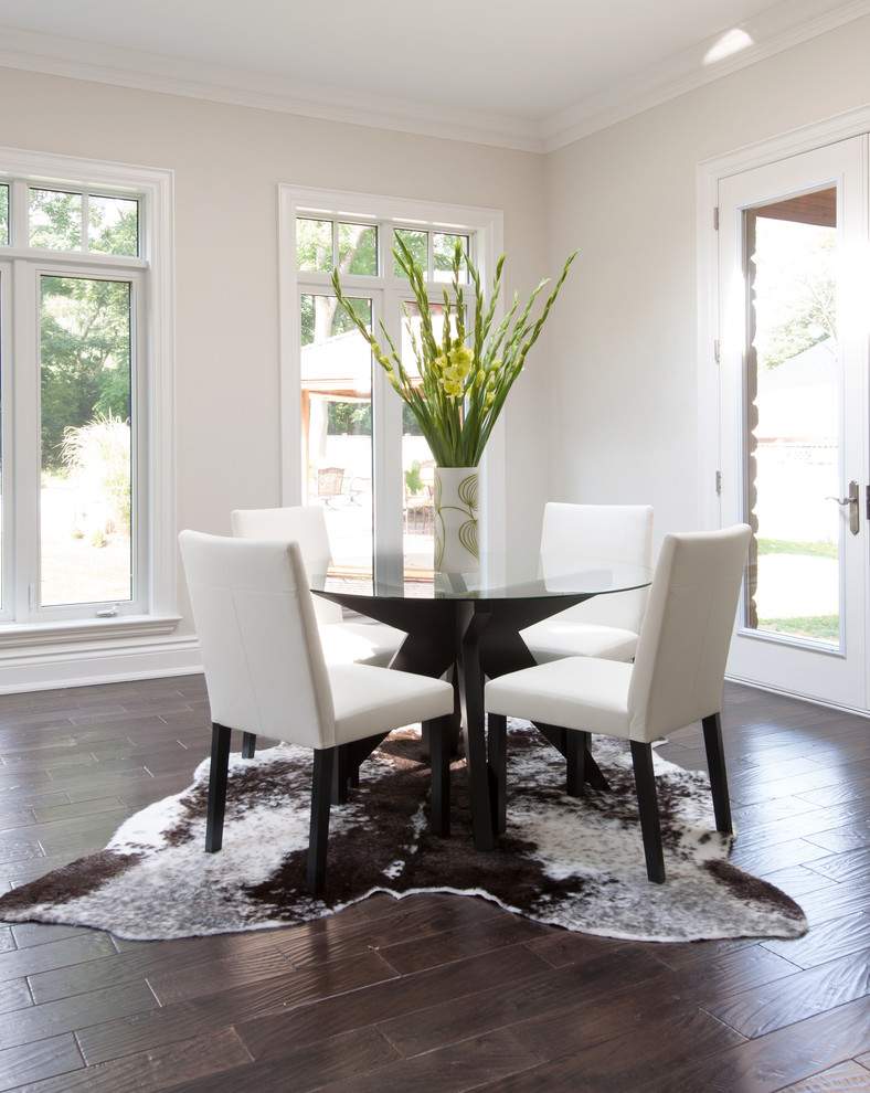 Inspiration for a contemporary dining room in Toronto with white walls and dark hardwood floors.