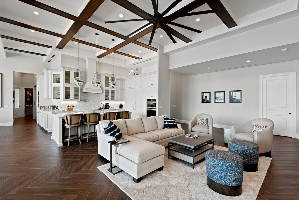 Large transitional open concept dark wood floor and brown floor living room photo in Other with gray walls