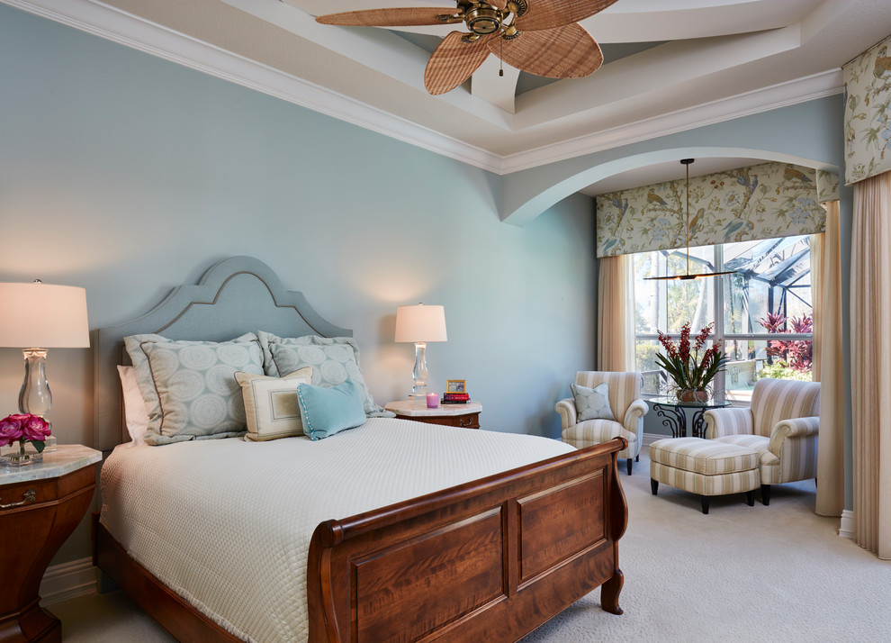 Inspiration for a large timeless master bedroom remodel in Miami with gray walls