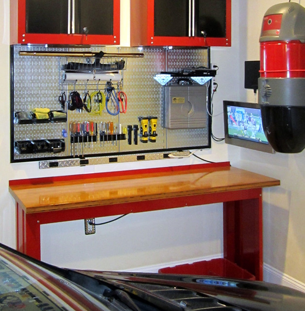 Wall Control Metallic Pegboard Over a Workbench with Custom Framing