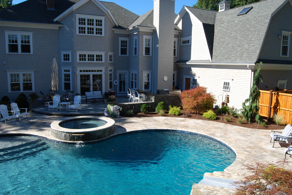 Example of a mid-sized mountain style backyard stone and kidney-shaped natural water slide design in Boston
