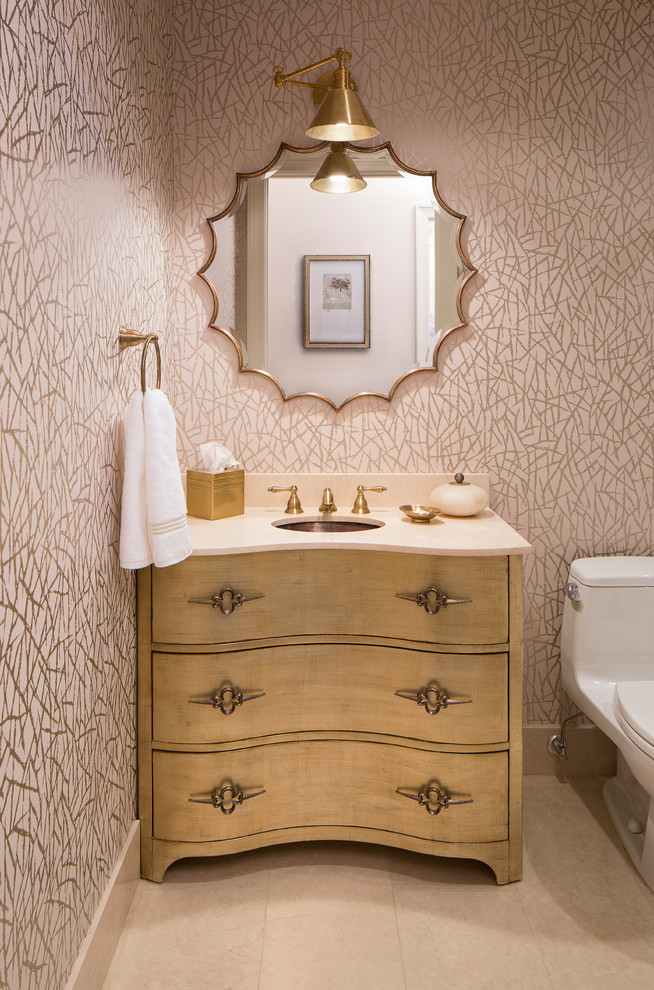 Inspiration for a mid-sized transitional powder room in Chicago with furniture-like cabinets, an undermount sink, light wood cabinets, multi-coloured walls and white benchtops.
