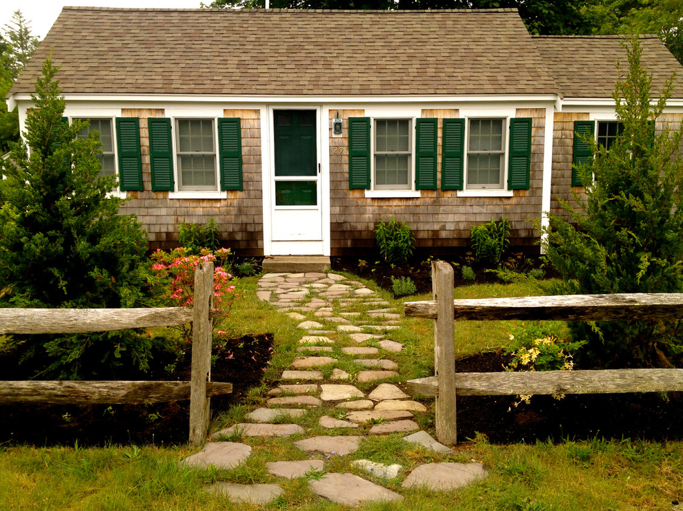 Photo of a small beach style front yard full sun garden in Boston with a garden path and natural stone pavers.