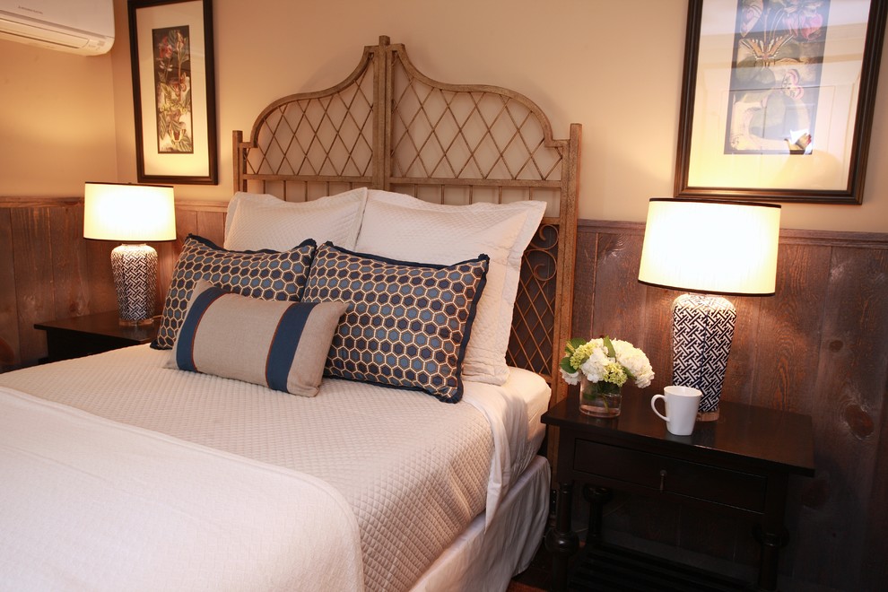This is an example of a mid-sized eclectic guest bedroom in Atlanta with beige walls, carpet and no fireplace.