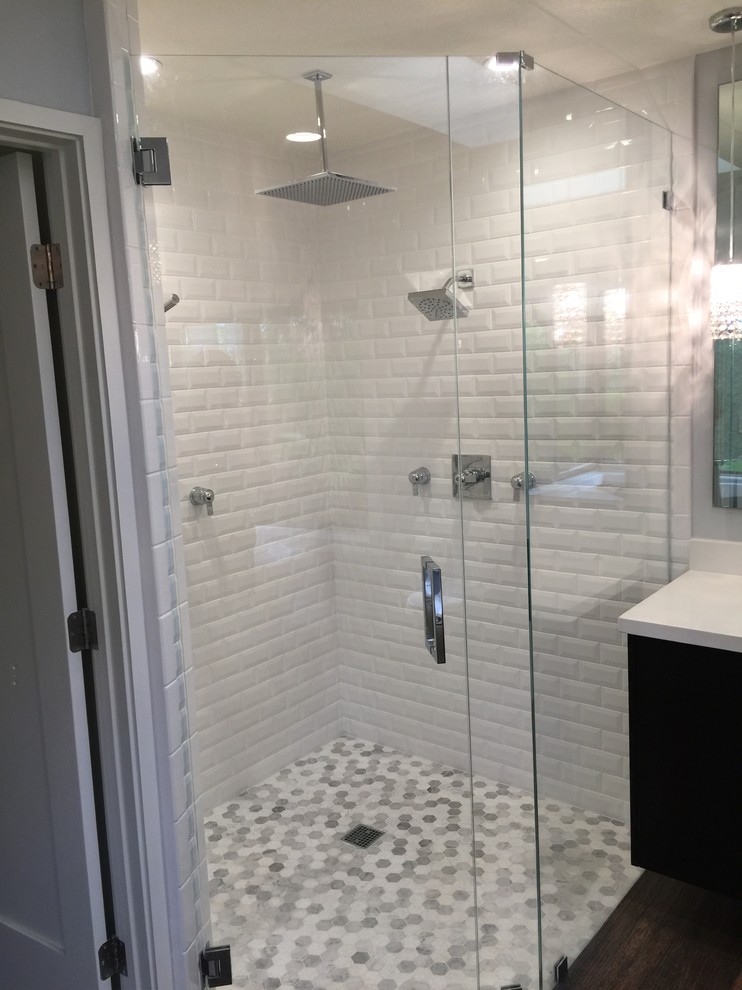 Design ideas for a large contemporary master bathroom in Miami with flat-panel cabinets, dark wood cabinets, a freestanding tub, a corner shower, a one-piece toilet, white tile, porcelain tile, grey walls, porcelain floors, an undermount sink, engineered quartz benchtops, brown floor and a hinged shower door.