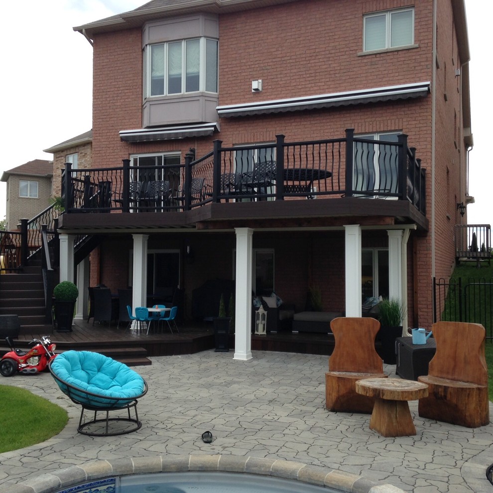 Inspiration for a mid-sized modern backyard deck remodel in Toronto