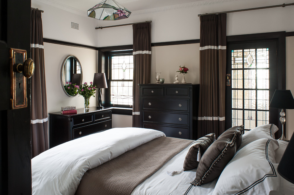 Inspiration for a traditional bedroom in Sydney with beige walls.