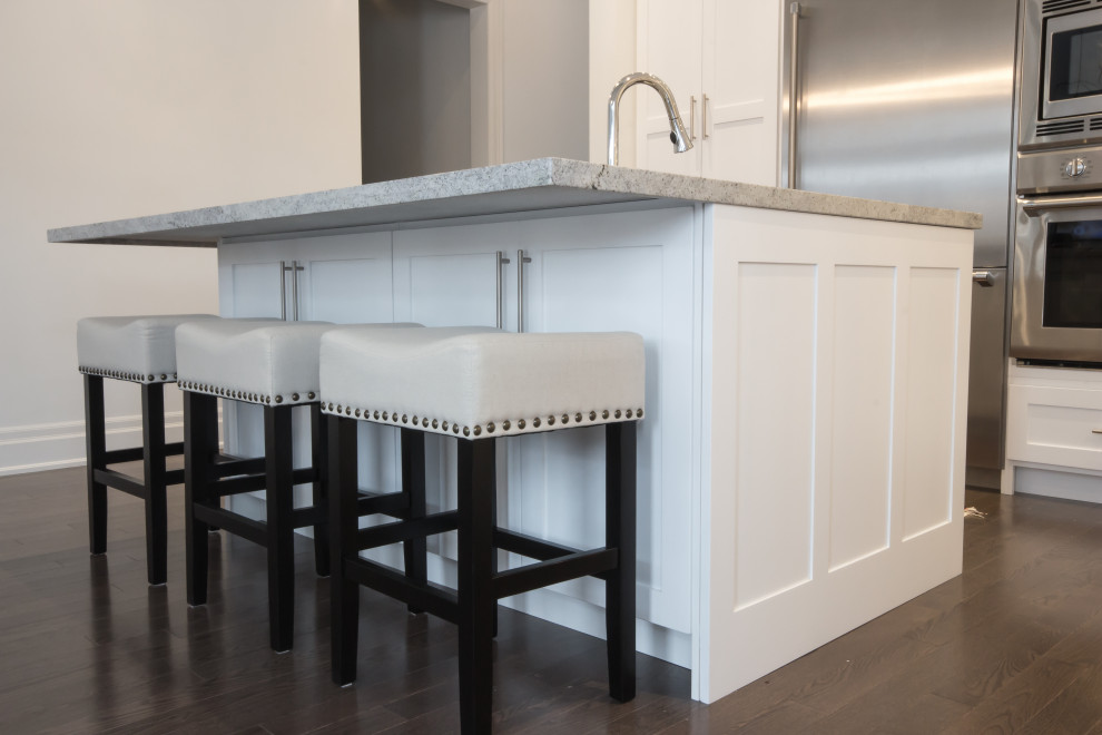 Example of a transitional kitchen design in Toronto