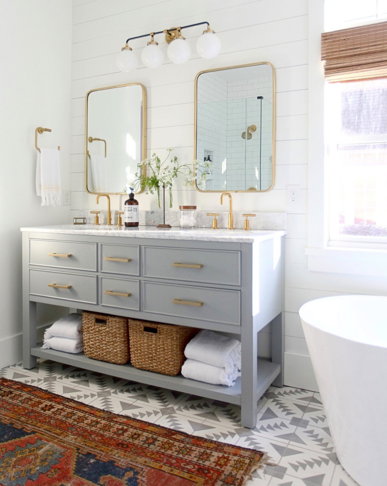 Design ideas for a traditional master bathroom in Atlanta with grey cabinets, a freestanding tub, white walls, multi-coloured floor, white benchtops, a double vanity, a freestanding vanity and planked wall panelling.