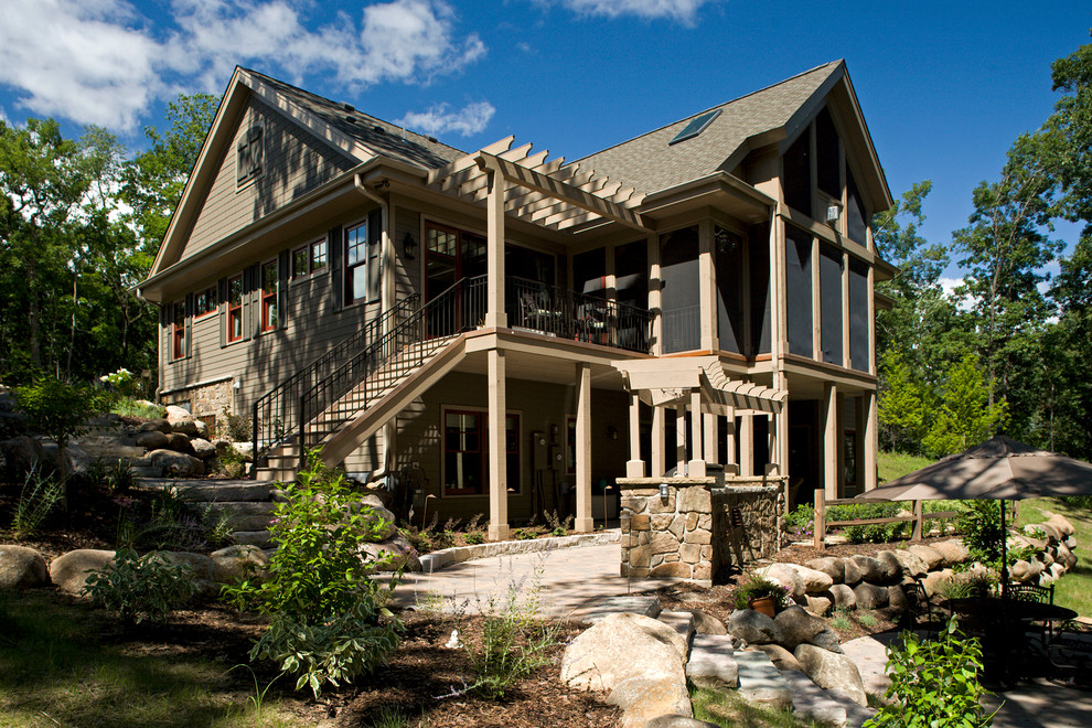 Design ideas for a large traditional one-storey exterior in Minneapolis with mixed siding.