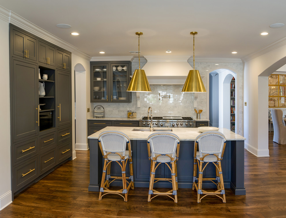 Transitional dark wood floor and brown floor kitchen pantry photo with beaded inset cabinets, gray cabinets, white backsplash, paneled appliances, an island and white countertops