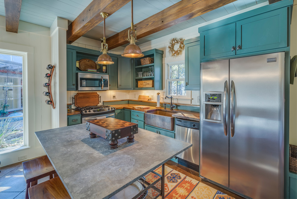 Photo of a country l-shaped kitchen in Atlanta with a farmhouse sink, shaker cabinets, stainless steel appliances, with island and turquoise cabinets.