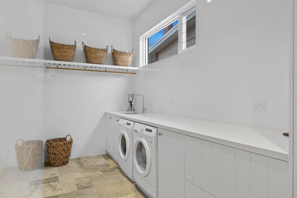 Inspiration for a contemporary laundry room in Central Coast with quartz benchtops.