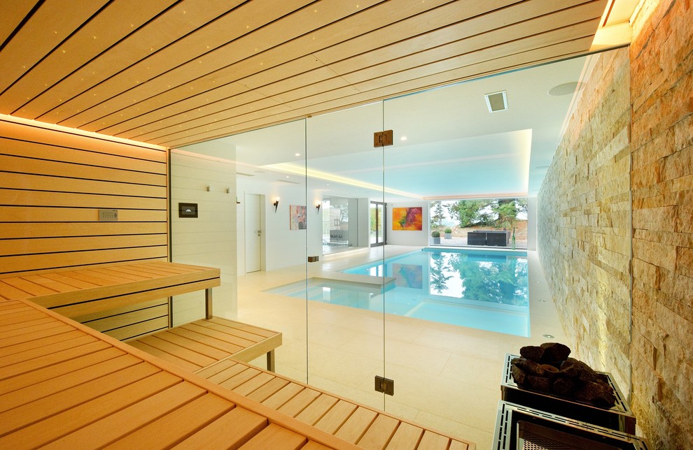 Inspiration for a contemporary indoor rectangular pool in London.