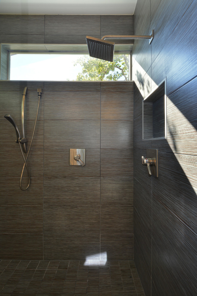 This is an example of a contemporary bathroom in Austin with an undermount sink, flat-panel cabinets, light wood cabinets, engineered quartz benchtops, a double shower, black tile and ceramic tile.