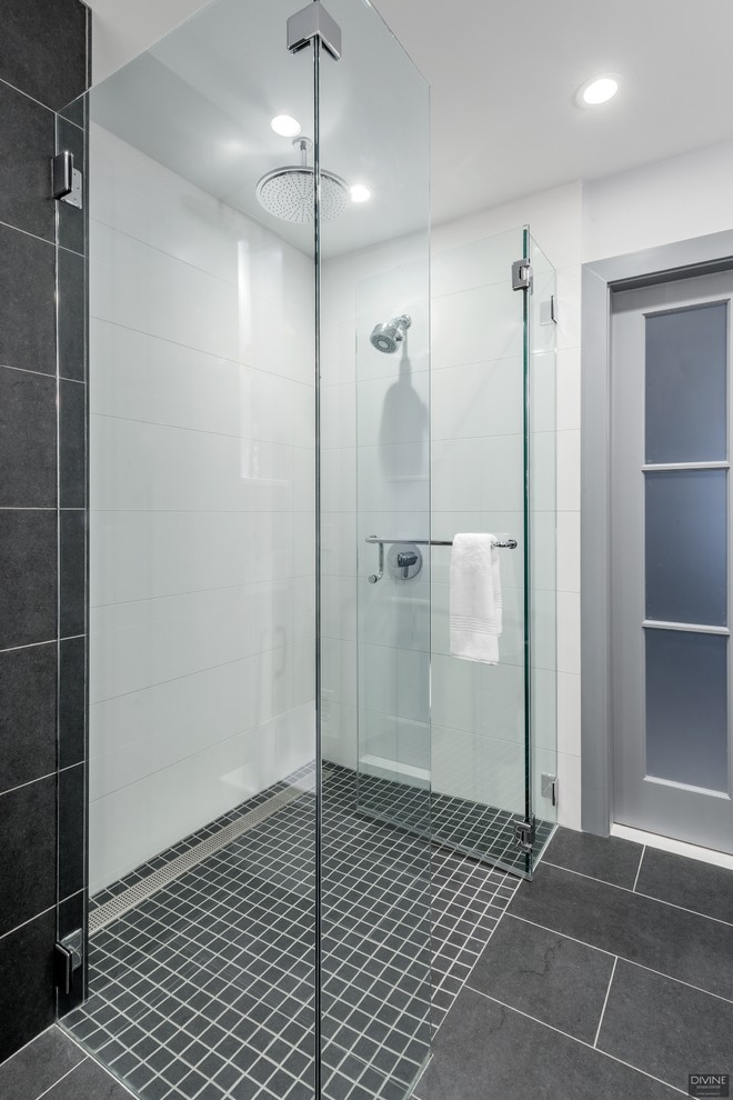 Design ideas for a mid-sized modern 3/4 bathroom in Boston with flat-panel cabinets, white cabinets, a curbless shower, a one-piece toilet, blue tile, glass tile, blue walls, slate floors, an undermount sink, engineered quartz benchtops, multi-coloured floor, a hinged shower door and grey benchtops.