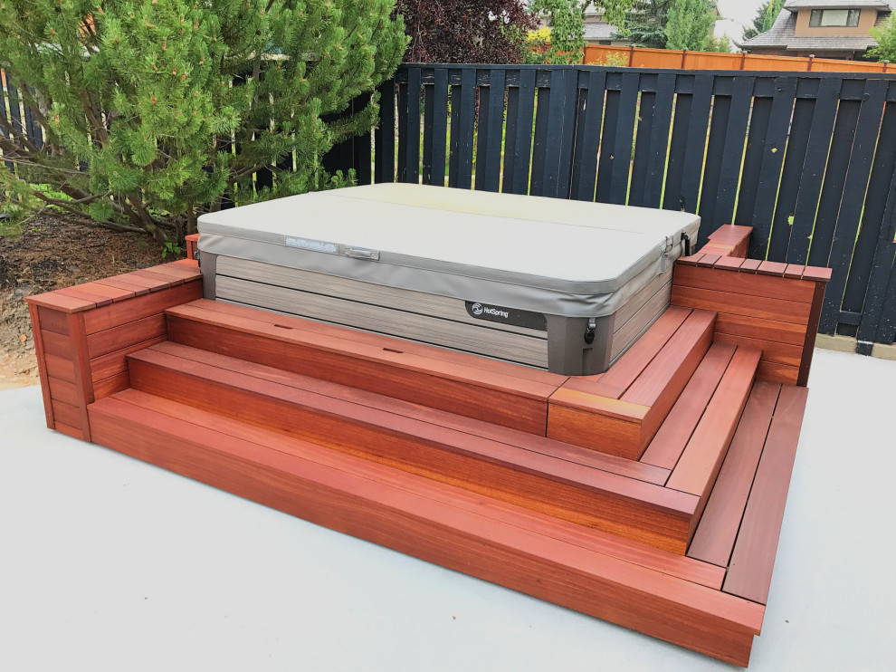 Deck - mid-sized transitional backyard deck idea in Calgary