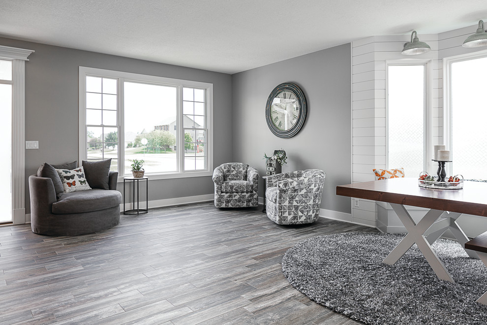 Photo of a mid-sized transitional open concept living room in Other with ceramic floors and multi-coloured floor.