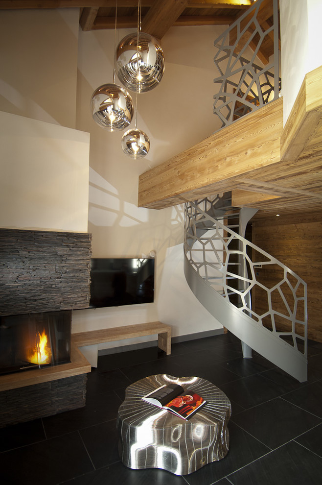 Inspiration for a contemporary metal spiral staircase in Clermont-Ferrand with open risers and metal railing.