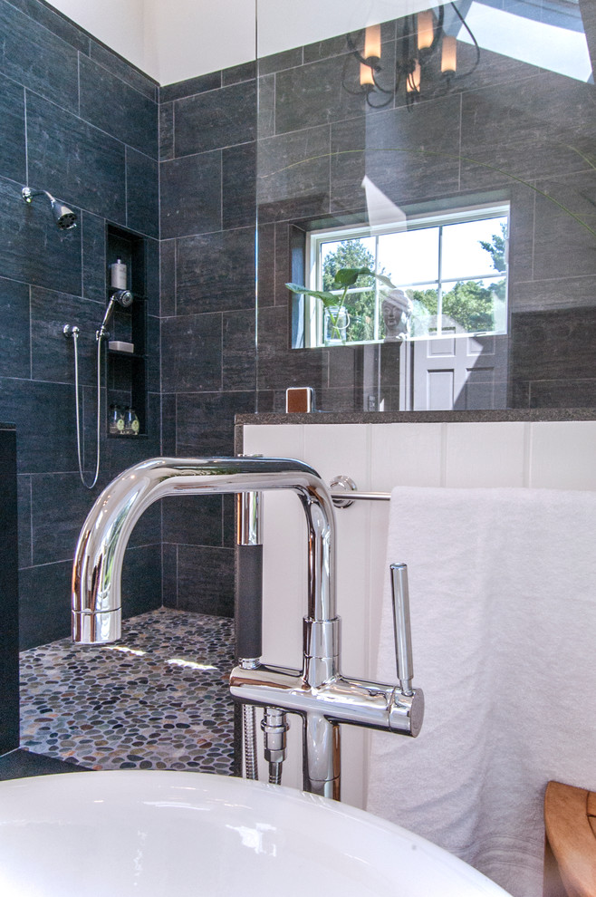 Design ideas for a large modern master bathroom in Philadelphia with a freestanding tub, an open shower, black tile, porcelain tile, pebble tile floors and beige walls.