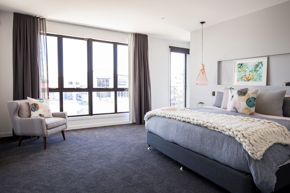 This is an example of a large contemporary master bedroom in Gold Coast - Tweed with grey walls and carpet.