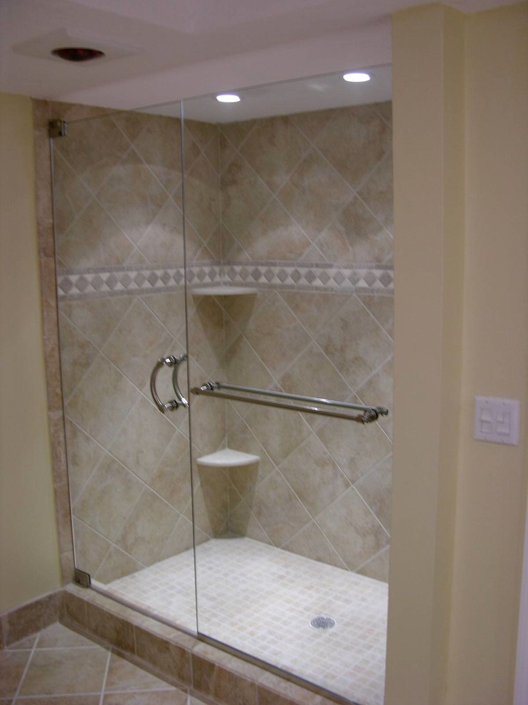 Alcove shower - transitional 3/4 beige tile and ceramic tile ceramic tile and beige floor alcove shower idea with beige walls and a hinged shower door
