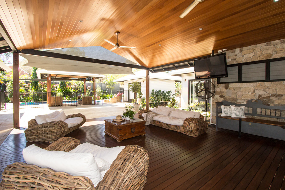 Inspiration for an expansive country backyard deck in Dunedin with a roof extension.