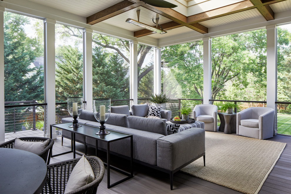 Design ideas for an expansive transitional backyard screened-in verandah in DC Metro with cable railing.