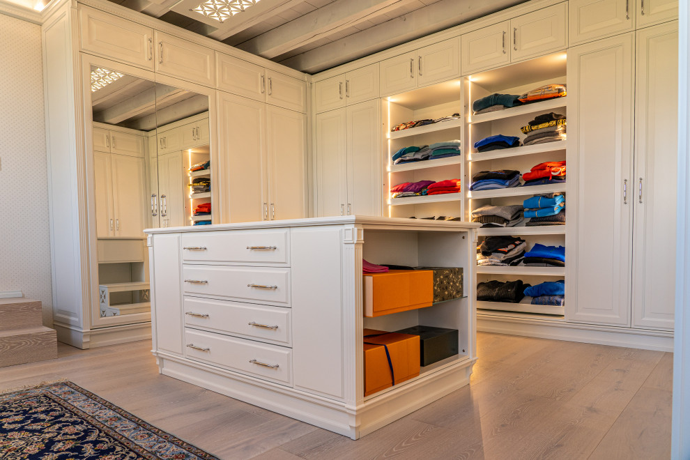 Inspiration for a contemporary storage and wardrobe in Other with white cabinets and exposed beam.