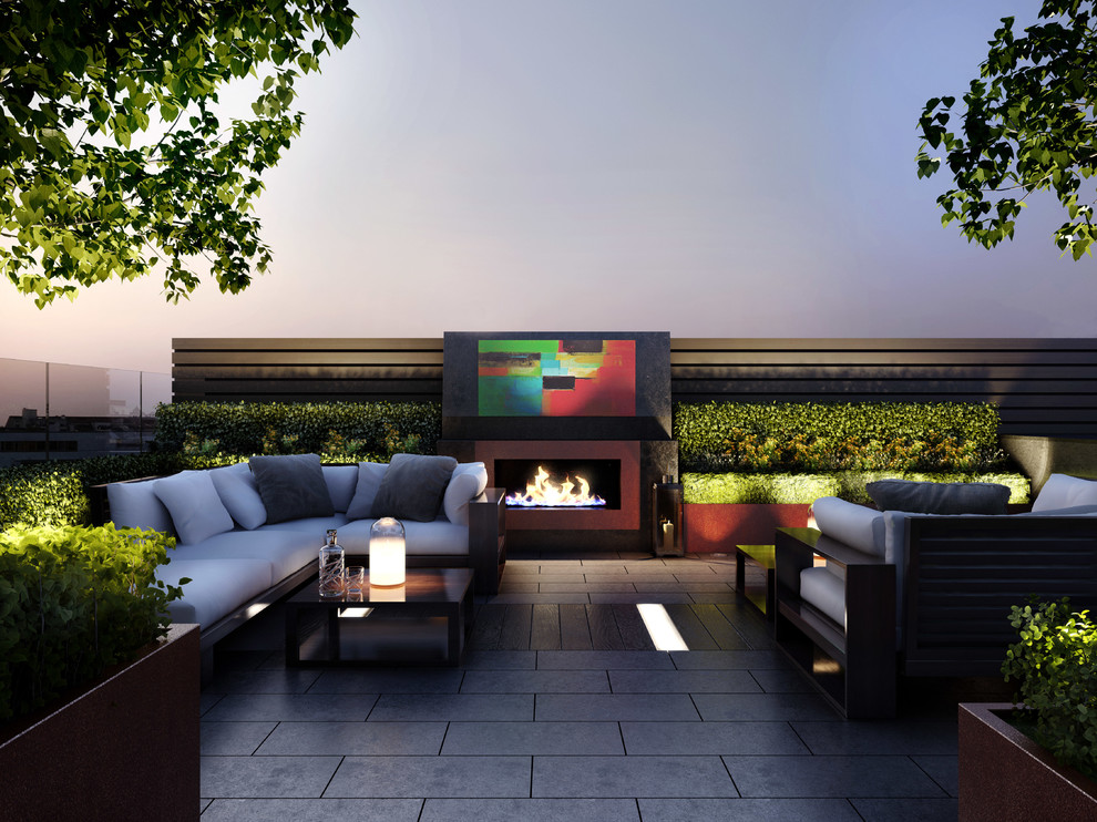 Small contemporary rooftop deck in London with a fire feature and no cover.