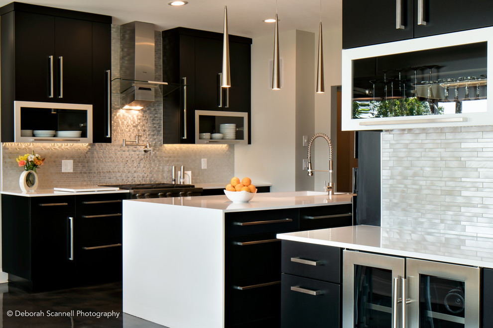 Design ideas for an expansive modern kitchen in Charlotte with flat-panel cabinets, black cabinets, quartz benchtops, grey splashback, metal splashback, stainless steel appliances and with island.