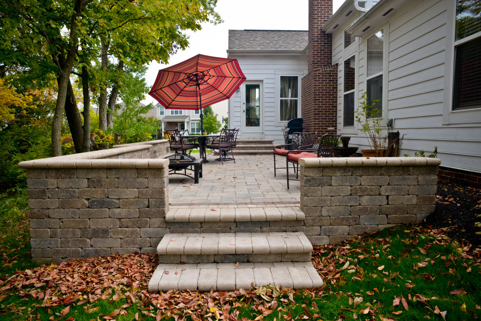 Design ideas for a medium sized traditional back garden in Columbus with concrete paving.