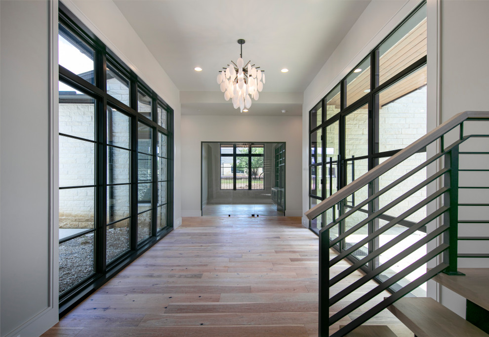 Inspiration for a medium sized classic hallway in Dallas with a double front door and a glass front door.