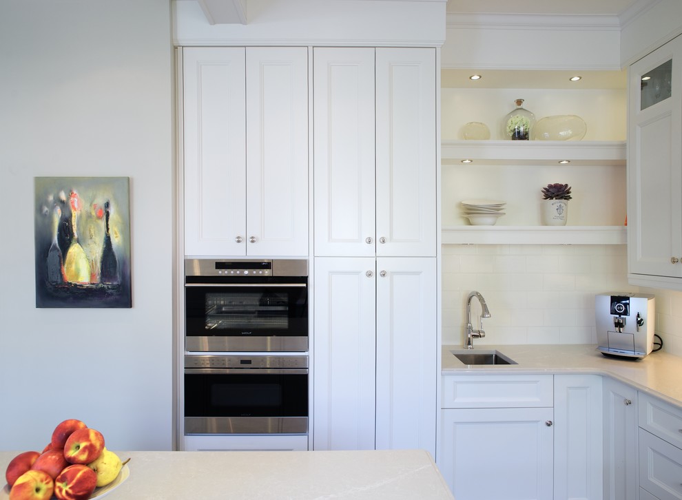 Example of a transitional kitchen design in Toronto