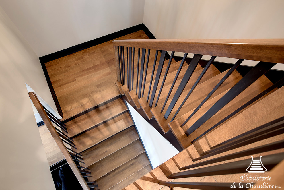 Small contemporary wood u-shaped staircase in Other with wood risers.