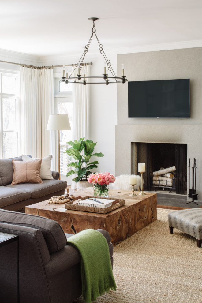 Large transitional open concept living room in DC Metro with grey walls, medium hardwood floors, a standard fireplace, a wall-mounted tv and grey floor.