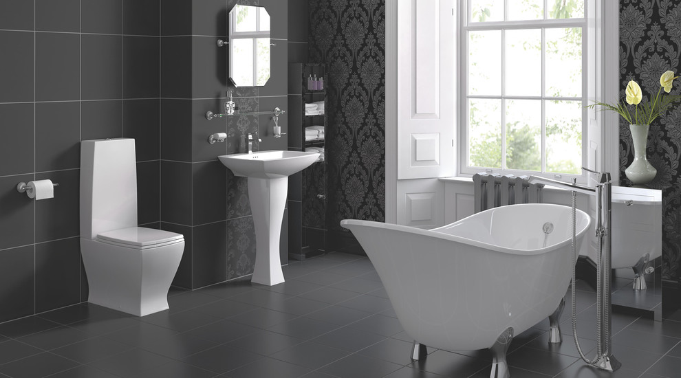 Inspiration for a large contemporary master bathroom in Hampshire with a wall-mount sink, furniture-like cabinets, a claw-foot tub, a shower/bathtub combo, a one-piece toilet, gray tile, grey walls and slate floors.