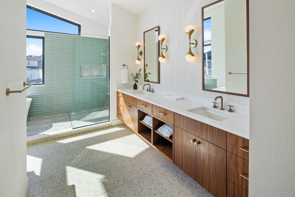 Inspiration for a large contemporary master multicolored floor, double-sink and vaulted ceiling bathroom remodel in Portland with flat-panel cabinets, a niche, a floating vanity, medium tone wood cabinets, white walls, an undermount sink and white countertops