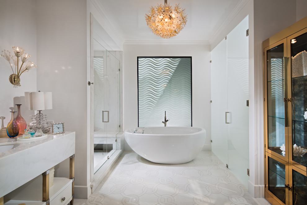 This is an example of an expansive contemporary master bathroom in Orange County with open cabinets, white cabinets, a freestanding tub, an alcove shower, white tile, white walls, an undermount sink, marble benchtops, marble, porcelain floors, white floor and a hinged shower door.