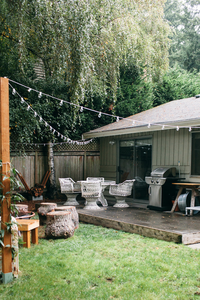 Photo of a mid-sized rustic backyard landscaping in Seattle with decking for summer.
